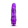 Translucent purple vibrating dildo has a realistic shape, with a subtle tapered head and veins along the shaft. Twist dial on bottom to adjust intensity. Additional images show alternate angles.