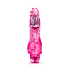 Translucent pink vibrating dildo has a realistic shape with a defined head and veins along the shaft. Silver bullet motor just below the head. Twist dial on bottom to adjust intensity. Additional images show alternate angles.