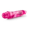 Glow in the dark pink realistic vibrating dildo. Defined head with skin folds under head and veins along straight shaft. Twist dial at bottom to adjust intensity. Additional images show alternate angles.