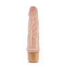 Vanilla skin tone vibrating dildo has an ultra realistic shape, with a subtle tapered head and veins along the shaft. Twist dial on bottom to adjust intensity. Additional images show alternate angles.
