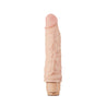 Vanilla skin tone vibrating dildo. Pronounced head with skin folds under the head and subtle veins along the shaft. Twist dial on bottom to adjust intensity. Additional images show alternate angles.