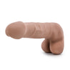 Mocha skin tone realistic dildo. Featuring a large rounded head. Veins along the straight shaft. Round realistic balls. Smooth flat base. Additional images show alternate angles.