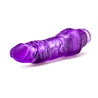 Translucent purple vibrating dildo has a realistic shape, with a defined but tapered head and veins along the shaft. Twist dial on bottom to adjust intensity. Additional images show alternate angles.
