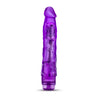 Translucent purple vibrating dildo has a realistic shape, with a defined but tapered head and veins along the shaft. Twist dial on bottom to adjust intensity. Additional images show alternate angles.
