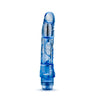 Translucent blue vibrating dildo has a realistic shape with a subtle rounded head and veins along the shaft. Silver bullet motor just below the head. Twist dial on bottom to adjust intensity. Additional images show alternate angles.