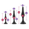 Set of three progressively sized black smooth silicone anal plugs, perfect for anal training. Each plug features a gently tapered tip, slight bulbous shape in the slim body, a narrower neck, and a circular flared base for safety.  Additional images show alternate angles.