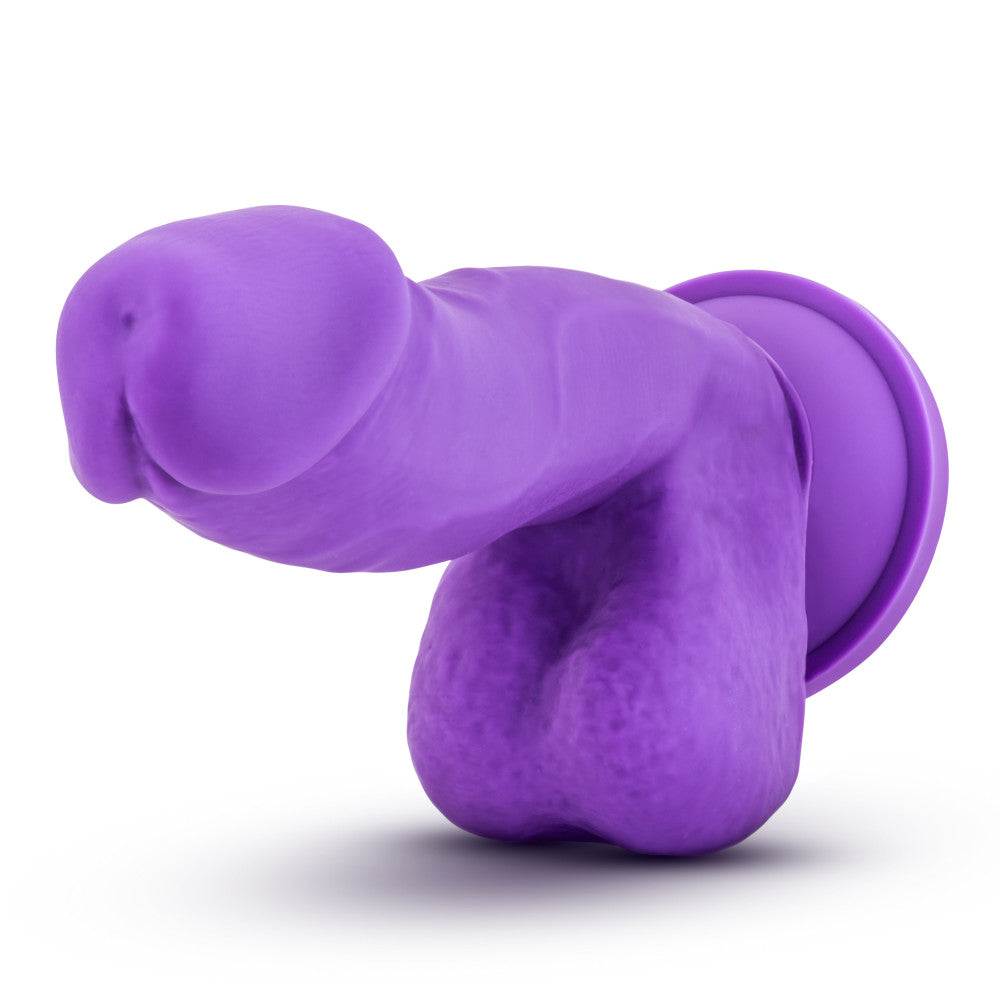 Purple realistic dildo featuring a realistic head with a pronounced lip, veins along the upwardly curved shaft, and realistic round balls. Suction cup base. Additional images show alternate angles.