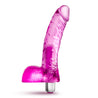 Translucent pink realistic vibrating dildo. With a subtle tapered head, curved shaft and veins and balls. Removable bullet with simple one-button operation.  Additional images show alternate angles.