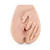 Vanilla skin tone vulva shaped masturbation sleeve with a realistic hand reaching down toward vaginal opening and one finger inserted into vagina. Slight crease at bottom to imply butt cheeks. Ribbed internal tunnel. Additional images show alternate angles.