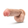 Vanilla skin tone ultra realistic dildo. Featuring a round head with a pronounced lip, many pronounced veins along the straight shaft, and realistic balls. Suction cup base. Additional images show alternate angles.