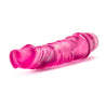 Translucent pink vibrating dildo. Pronounced curved head and subtle veins along the shaft. Twist dial on bottom to adjust intensity. Additional images show alternate angles.