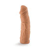 Mocha skin tone dildo featuring a rounded head and many veins along a slightly upwardly curved shaft. This dildo does not have a flared base. An opening at the bottom of the dildo makes it compatible with Lock On handles, harnesses, and other Lock On adapters. Additional images show alternate angles.