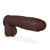 Chocolate skin tone ultra realistic dildo with a realistic head, subtle veins along the straight but flexible shaft and realistic balls. Longer and thicker than average. Suction cup base. Additional images show alternate angles.