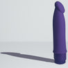 Purple vibrating dildo. Semi realistic shape with defined head and smooth straight shaft. Twist dial on bottom to control intensity. Additional images show alternate angles.