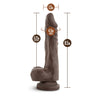 Chocolate skin tone ultra realistic dildo. Featuring a tapered realistic head for easy insertion, skin folds and veins along the straight but flexible shaft, and round realistic balls. Suction cup base. Additional images show alternate angles.