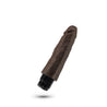 This chocolate skin tone vibrating dildo has an ultra realistic shape that offers significant girth, with a subtly defined head and veins along the shaft. Twist dial on bottom to adjust intensity. Additional images show alternate angles.