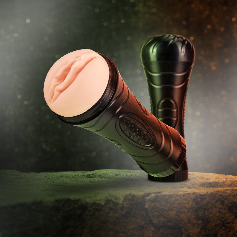 Ultra realistic, plush, vulva shaped, vanilla skin tone stroker in a black plastic canister. Sleeve can be removed from canister for easy cleaning. Canister features some texture for a secure grip. Includes a removable cap for discreet storage. Additional images show alternate angles.