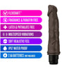 Chocolate skin tone vibrating dildo with curved head with veins along the slightly curved shaft. Twist dial on bottom to adjust intensity. Additional images show alternate angles.