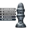 This black anal plug with a carbon metallic sheen has a rounded tapered tip that flares into a thicker body with two pronounced rounded ridges in the middle. Slimmer base and a flared base for comfort and safety.  Additional images show alternate angles.