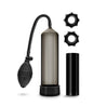 A 4 piece kit including a black squeeze ball penis pump with black transparent cylinder, pump sleeve, hose, and bulb. Also includes 2 stretchy black gear-shaped cock rings and a sleek black stroker that is open on both ends, has a smooth outside, and soft flexible nubs inside the canal for added stimulation. Additional images show alternate angles.