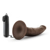 Chocolate skin tone with small tapered head and veins along the shaft, which has a slight upward curve. Suction cup base. Twist dial on wired remote to adjust intensity. Additional images show alternate angles.