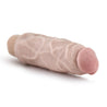 Vanilla skin tone vibrating dildo has an ultra realistic shape that offers significant girth, with a subtly defined head and veins along the shaft. Twist dial on bottom to adjust intensity. Additional images show alternate angles.