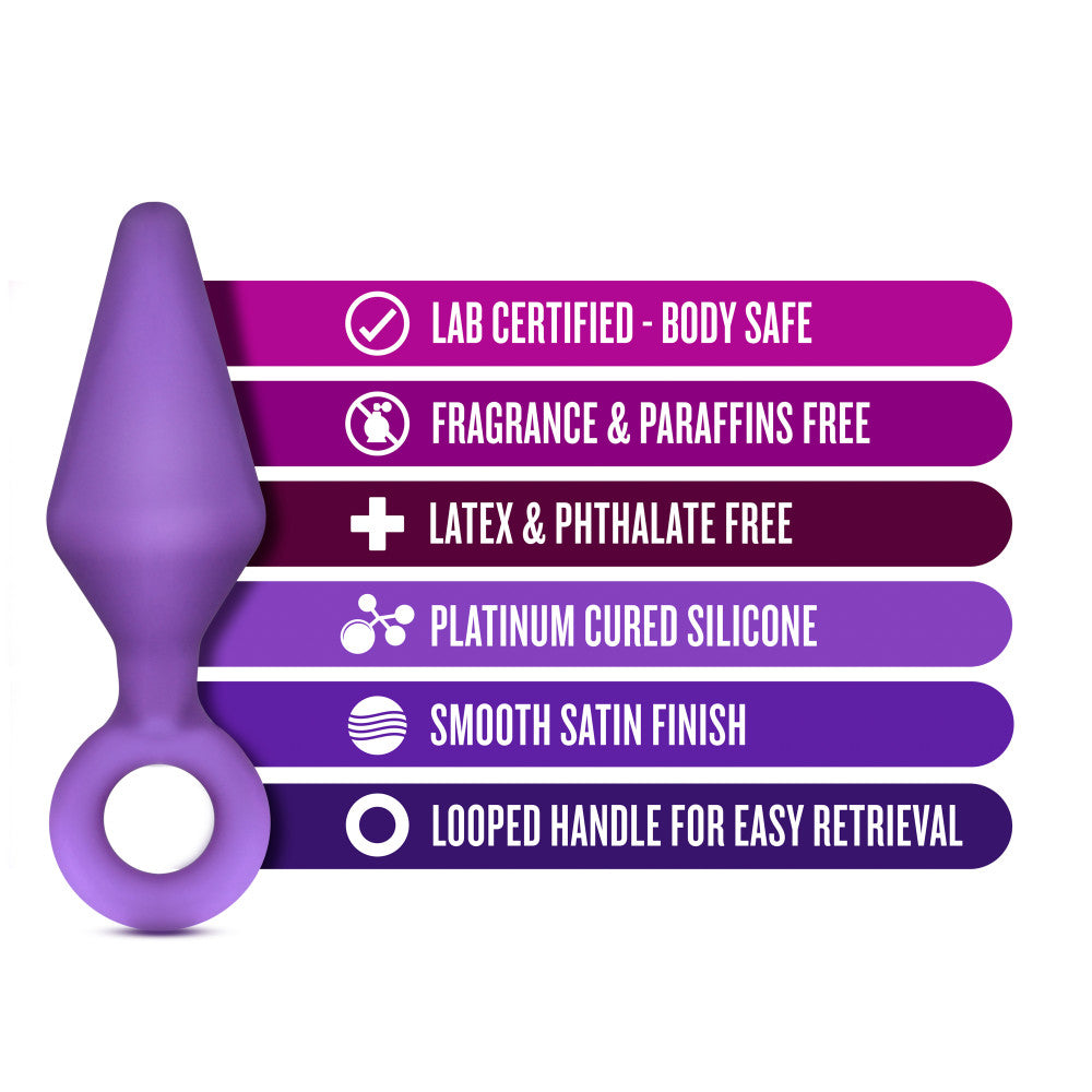 Three purple butt plugs, each with a tapered tip and slim neck. Each features a reinforced ring at the base for safety. This anal trainer kit features a small, medium, and large plug. Additional images show alternate angles.