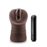 Chocolate skin tone stroker with a vulva shaped opening. Features gentle grooves on the outside for a secure grip. Ribbed internal canal for added stimulation. Additional images show alternate angles.