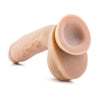 Vanilla skin tone ultra realistic dildo. Featuring a realistic head, subtle veins along the straight but flexible shaft that's a little thicker near the head and gently tapers to a thinner girth closer to the realistic balls. Suction cup base. Additional images show alternate angles.