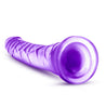 Translucent purple dildo with a slim tapered realistic head for easy insertion and subtle veins along the slightly upwardly curved shaft. Suction cup base. Additional images show alternate angles.