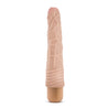 Vanilla skin tone vibrating dildo. Slim tapered head with veins along the shaft and wavy ribs at base. Twist dial on bottom to adjust intensity. Additional images show alternate angles.