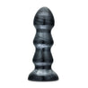 An extra large black anal plug with a carbon metallic sheen. This plug features three ridges that flare out and back in significantly for an extreme sensation. Featuring a flared circular base for safety. Additional images show alternate angles.