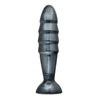 An extra large black anal plug with a carbon metallic sheen. This longer plug features four ridges that flare out and back in significantly for an extreme sensation. Circular flared base for safety. Additional images show alternate angles.