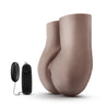 Chocolate skin tone, life sized stroker. Features realistic vulva and two openings, a vaginal opening and an anal opening. Ribbed inner tunnels.  Additional images show alternate angles.