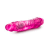 Glow in the dark pink realistic vibrating dildo. Defined head with skin folds under head and veins along straight shaft. Twist dial at bottom to adjust intensity. Additional images show alternate angles.