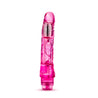 Translucent pink vibrating dildo has a realistic shape with a subtle rounded head and veins along the shaft. Silver bullet motor just below the head. Twist dial on bottom to adjust intensity. Additional images show alternate angles.