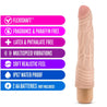 Vanilla skin tone vibrating dildo. Slim tapered head with veins along the shaft and wavy ribs at base. Twist dial on bottom to adjust intensity. Additional images show alternate angles.