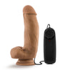 Vibrating realistic cock with suction cup. Mocha skin tone with pronounced head, veins along the shaft, and plush balls. Wired remote with twist dial to adjust intensity. Additional images show alternate angles.