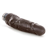 This chocolate skin tone vibrating dildo has an ultra realistic shape that offers significant girth, with a subtly defined head and veins along the shaft. Twist dial on bottom to adjust intensity. Additional images show alternate angles.