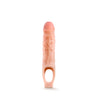 Vanilla skin tone ultra realistic hollow penis extender with a strap at the base that goes around the scrotum for stability. Sheath is very plush and has a veined texture and slightly pink colored head for a lifelike look.   Additional images show alternate angles.