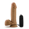 Vibrating realistic cock with suction cup. Mocha skin tone with pronounced head, veins along the shaft, and plush balls. Wired remote with twist dial to adjust intensity. Additional images show alternate angles.