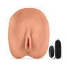 Mocha skin tone stroker. Vulva shaped stroker with ribbed tunnel. Removable wired bullet vibrator for added stimulation. Open on both ends. Additional images show alternate angles.