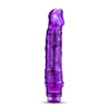 Translucent purple vibrating dildo. Pronounced curved head and subtle veins along the shaft. Twist dial on bottom to adjust intensity. Additional images show alternate angles.