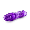 Translucent purple vibrating dildo, realistic shape with a defined head, subtle ridges below the head, and veins along the shaft. Silver bullet motor just below the head. Twist dial on bottom to adjust intensity. Additional images show alternate angles.