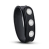 Black silicone strap with three silver metal snaps. Smooth silicone, low profile snaps. This adjustable ring is thin and flat. Additional images show alternate angles.