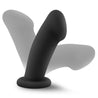 Black non-representational dildo. With a pronounced head that features a dimple to represent a urethral opening, a smooth thick shaft with and upward curve and a suction cup base.  Additional images show alternate angles.