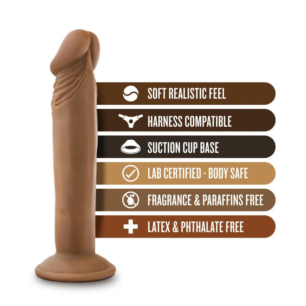 Mocha skin tone realistic dildo with a pronounced rounded head, skin folds beneath the head, subtle veins along the straight but flexible shaft, and a suction cup base. Additional images show alternate angles.