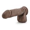 Chocolate skin tone realistic dildo. Featuring a rounded head, veins along a straight but flexible shaft, and realistic balls. Suction cup base. Additional images show alternate angles.