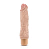 Vanilla skin tone vibrating dildo. Pronounced head with skin folds under the head and subtle veins along the shaft. Twist dial on bottom to adjust intensity. Additional images show alternate angles.