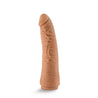 Mocha skin tone dildo featuring a tapered head for easy insertion and many veins along a slightly upwardly curved shaft. This dildo does not have a flared base. An opening at the bottom of the dildo makes it compatible with Lock On handles, harnesses, and other Lock On adapters. Additional images show alternate angles.